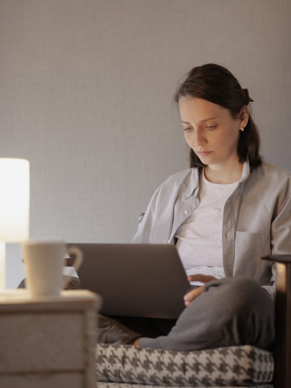 european-woman-in-a-home-office-is-working-on-a-laptop-a-cozy-house-or-apartment-for-the-work.jpg